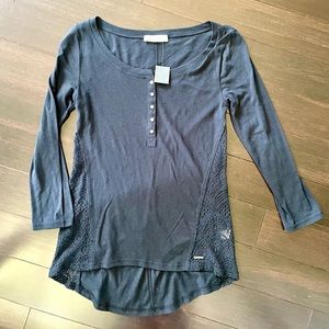 Henley top with lower back hem and lovely lace detail along the sides.